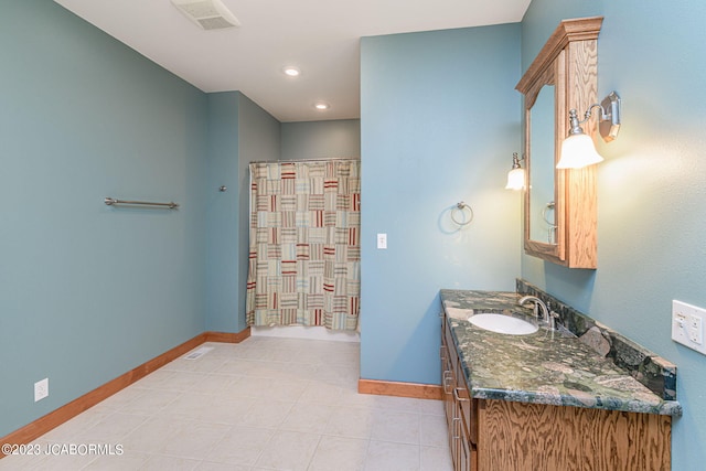 bathroom with a shower with curtain and vanity