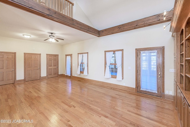 unfurnished living room with ceiling fan and light hardwood / wood-style flooring