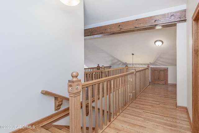 corridor with light hardwood / wood-style floors