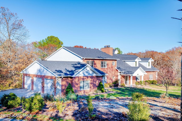 view of front of house with a front yard and a garage