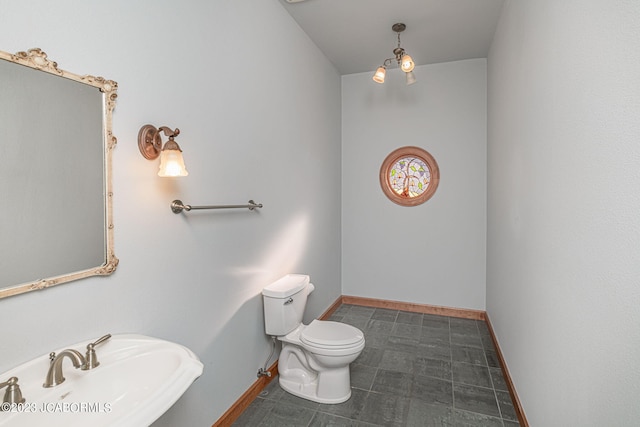 bathroom with tile patterned floors, toilet, and sink