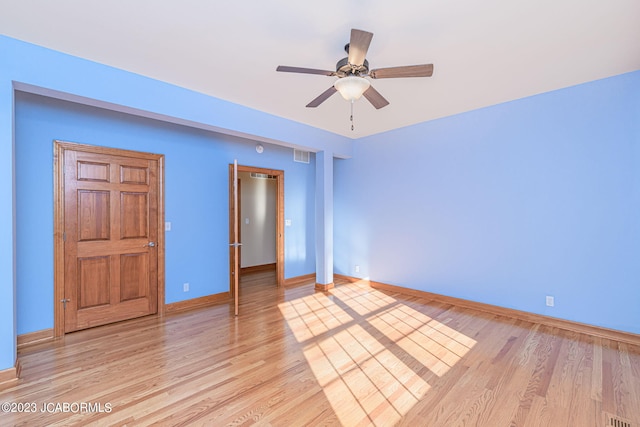 unfurnished bedroom with ceiling fan and light hardwood / wood-style floors