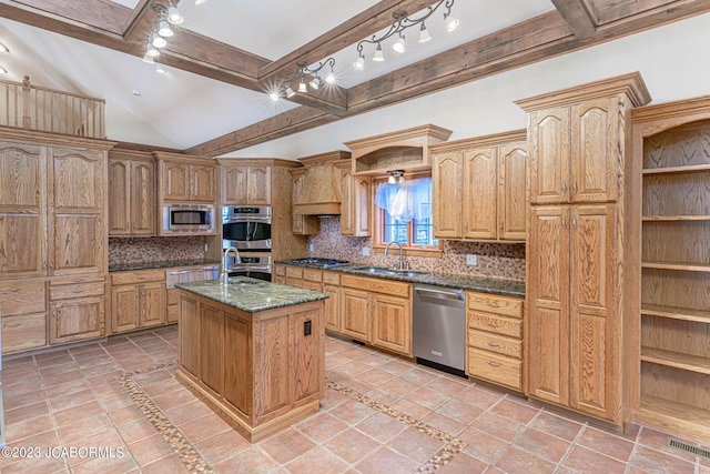 kitchen featuring tasteful backsplash, sink, a center island with sink, and appliances with stainless steel finishes