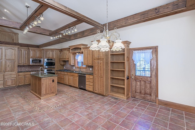 kitchen with tasteful backsplash, a kitchen island with sink, pendant lighting, and stainless steel appliances