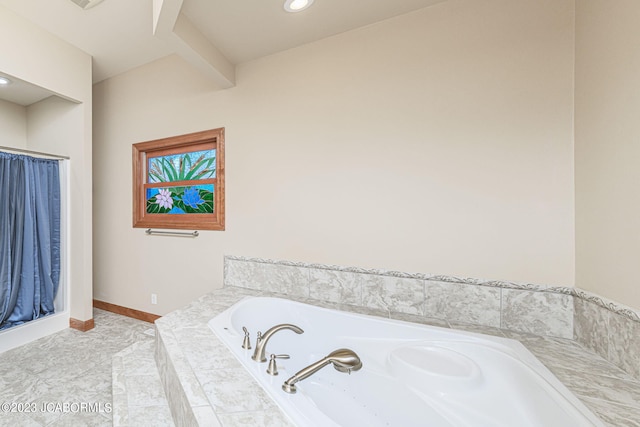 bathroom featuring tiled bath