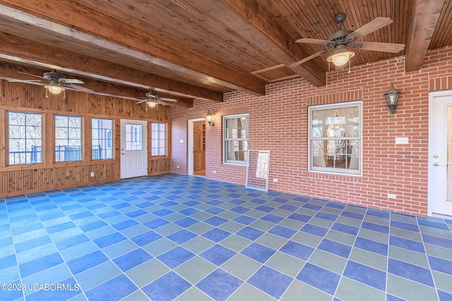 interior space with ceiling fan