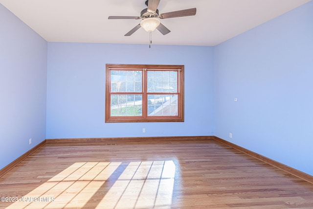 spare room featuring ceiling fan and light wood-type flooring