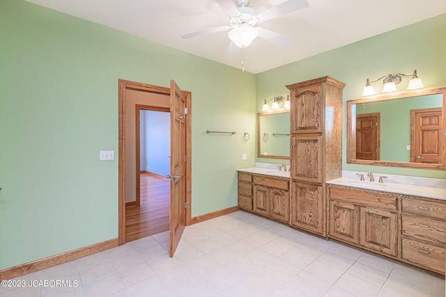 bathroom with ceiling fan and vanity