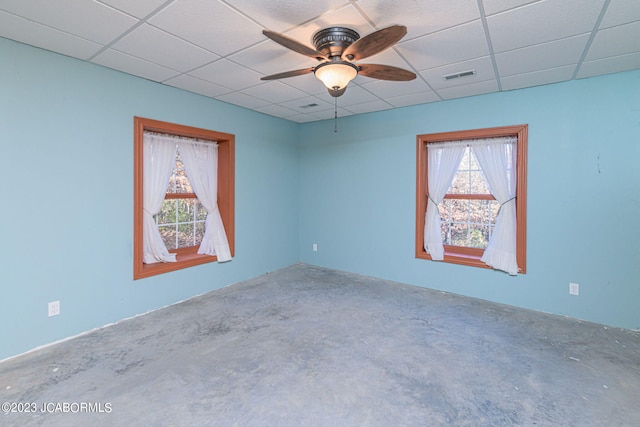 unfurnished room featuring a paneled ceiling and ceiling fan