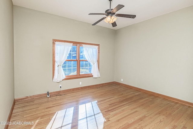 empty room with light hardwood / wood-style flooring and ceiling fan