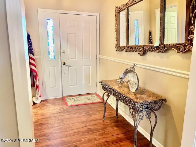 foyer entrance featuring hardwood / wood-style flooring