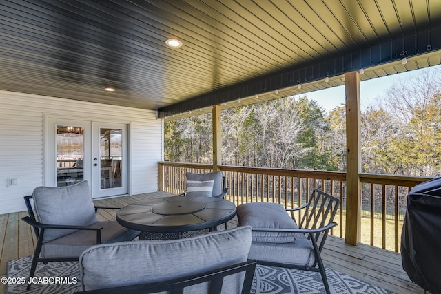 deck with outdoor dining area