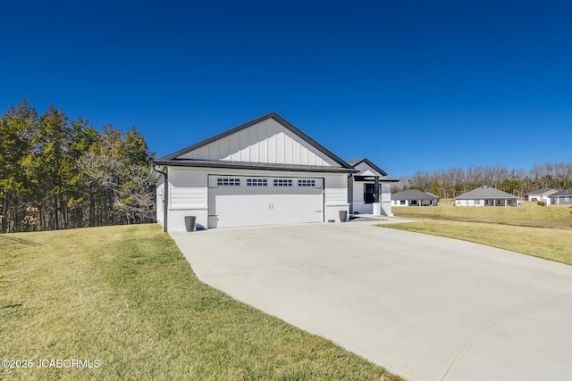 exterior space featuring an attached garage, driveway, board and batten siding, and a front yard