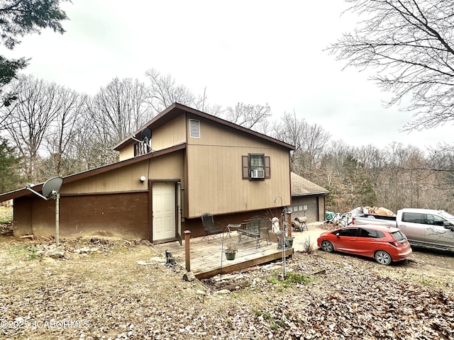 view of side of home with a deck