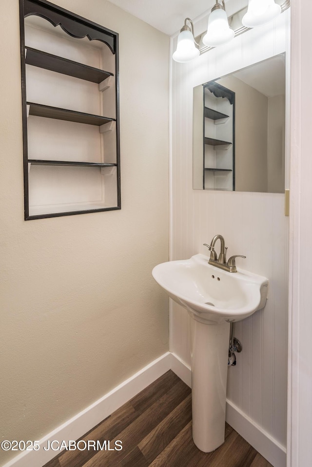 1811 W Main St, Jefferson City, MO 65109 - bathroom featuring wood finished floors and baseboards