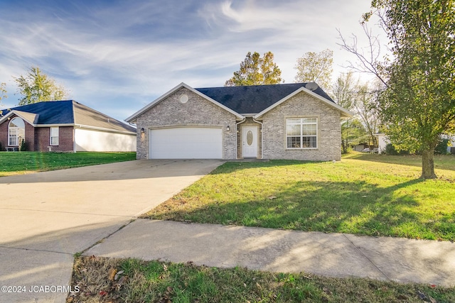 ranch-style house with a front yard and a garage