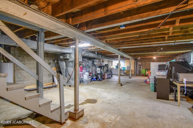 202 S Fourth St, Linn, MO 65051 - unfinished below grade area featuring water heater and stairway