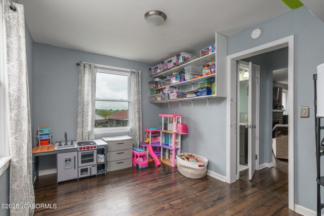 202 S Fourth St, Linn, MO 65051 - rec room with baseboards and dark wood-style floors