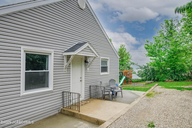 202 S Fourth St, Linn, MO 65051 - back of property featuring a playground and a patio