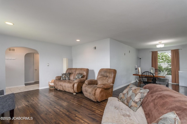 202 S Fourth St, Linn, MO 65051 - living area featuring arched walkways, visible vents, and wood finished floors