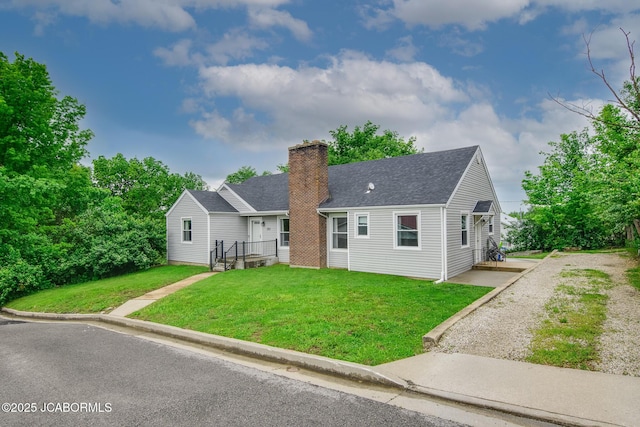 202 S Fourth St, Linn, MO 65051 - view of front facade featuring roof with shingles, a chimney, and a front yard