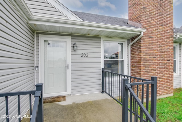202 S Fourth St, Linn, MO 65051 - entrance to property featuring brick siding and a shingled roof