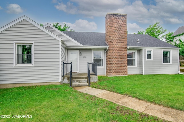202 S Fourth St, Linn, MO 65051 - exterior space featuring a shingled roof, a yard, and a chimney
