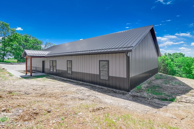 8206 Big Meadows Rd, Jefferson City, MO 65101 - view of side of property with a standing seam roof and metal roof