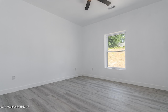 8206 Big Meadows Rd, Jefferson City, MO 65101 - spare room featuring ceiling fan, wood finished floors, and baseboards