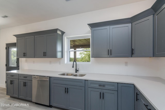 8206 Big Meadows Rd, Jefferson City, MO 65101 - kitchen featuring dishwasher, a sink, healthy amount of natural light, and light countertops