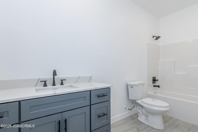 8206 Big Meadows Rd, Jefferson City, MO 65101 - full bathroom featuring toilet, wood finished floors, vanity, shower / bath combination, and baseboards