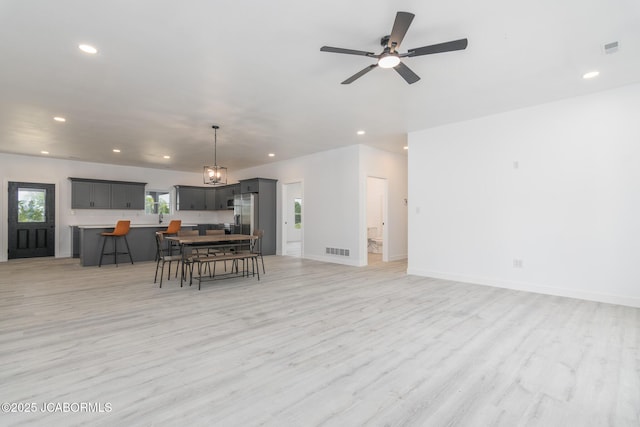 8206 Big Meadows Rd, Jefferson City, MO 65101 - living room featuring recessed lighting, light wood-style flooring, a ceiling fan, and baseboards