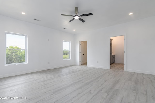 8206 Big Meadows Rd, Jefferson City, MO 65101 - unfurnished room featuring healthy amount of natural light, a ceiling fan, light wood-style flooring, recessed lighting, and baseboards