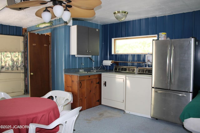 6640 Doe Vw, Steedman, MO 65077 - kitchen featuring freestanding refrigerator, washer and dryer, ceiling fan, a sink, and light carpet
