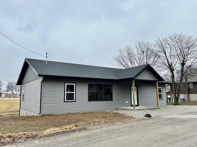 single story home featuring covered porch