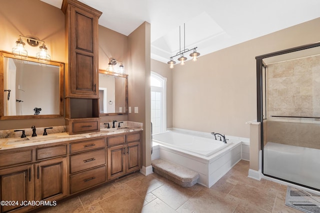 bathroom featuring vanity and shower with separate bathtub