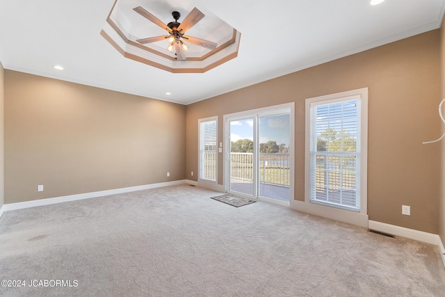 carpeted empty room with ceiling fan and ornamental molding