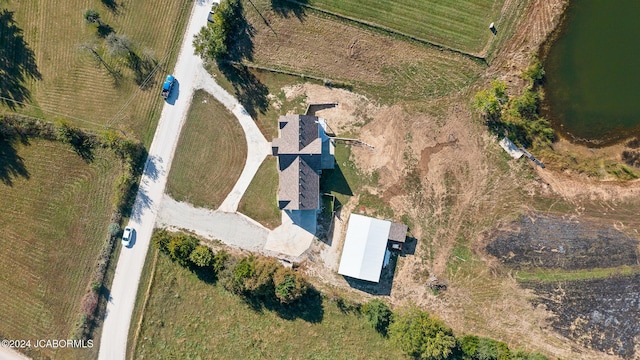 birds eye view of property with a rural view