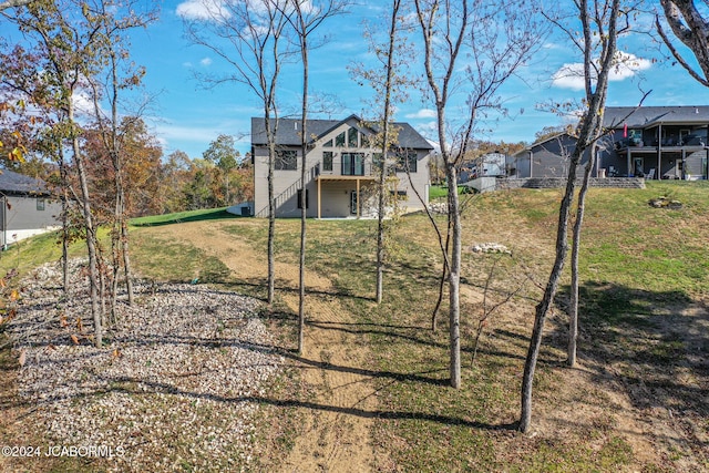 view of yard featuring stairway