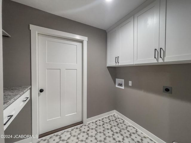 laundry room with baseboards, light floors, hookup for a washing machine, cabinet space, and electric dryer hookup