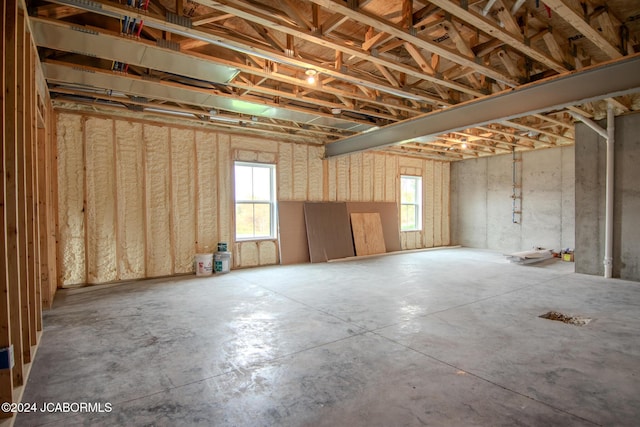 basement featuring a wealth of natural light and a garage