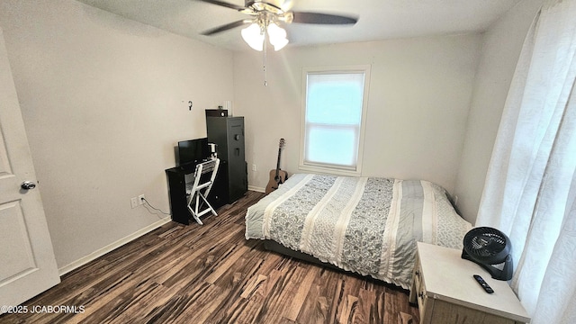 bedroom featuring dark hardwood / wood-style flooring and ceiling fan