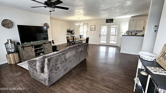 living room featuring ceiling fan and dark hardwood / wood-style flooring