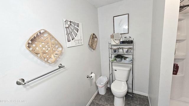 bathroom with tile patterned flooring and toilet