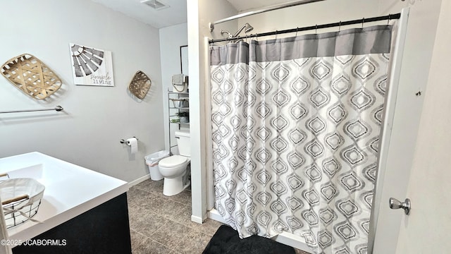 bathroom featuring vanity, tile patterned flooring, a shower with curtain, and toilet