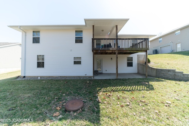 rear view of property with central AC unit, a yard, a patio area, and a wooden deck