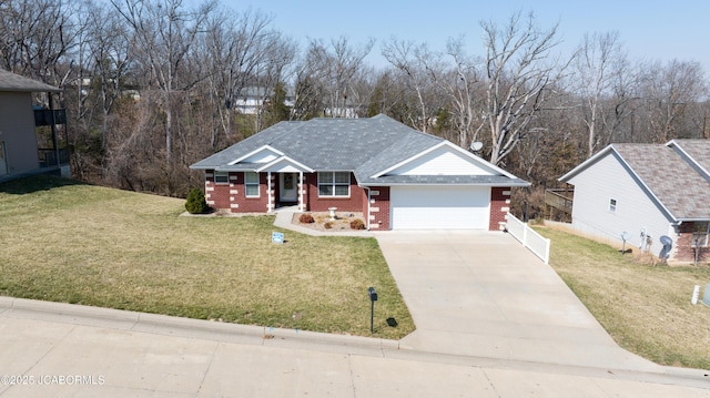 single story home with a shingled roof, concrete driveway, a front lawn, a garage, and brick siding