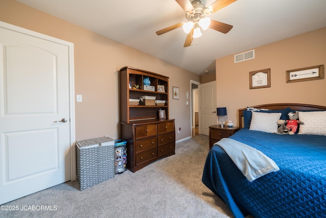 carpeted bedroom featuring visible vents and ceiling fan