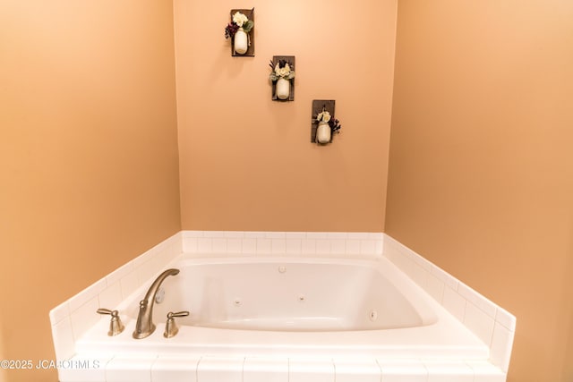 bathroom featuring a tub with jets