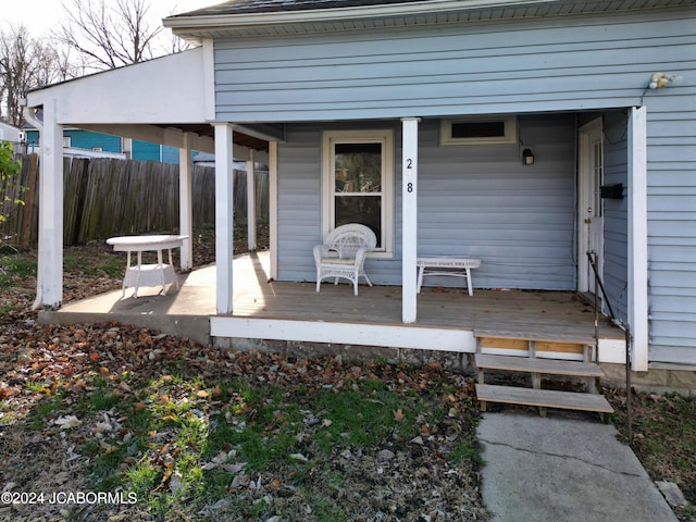 wooden terrace featuring a porch